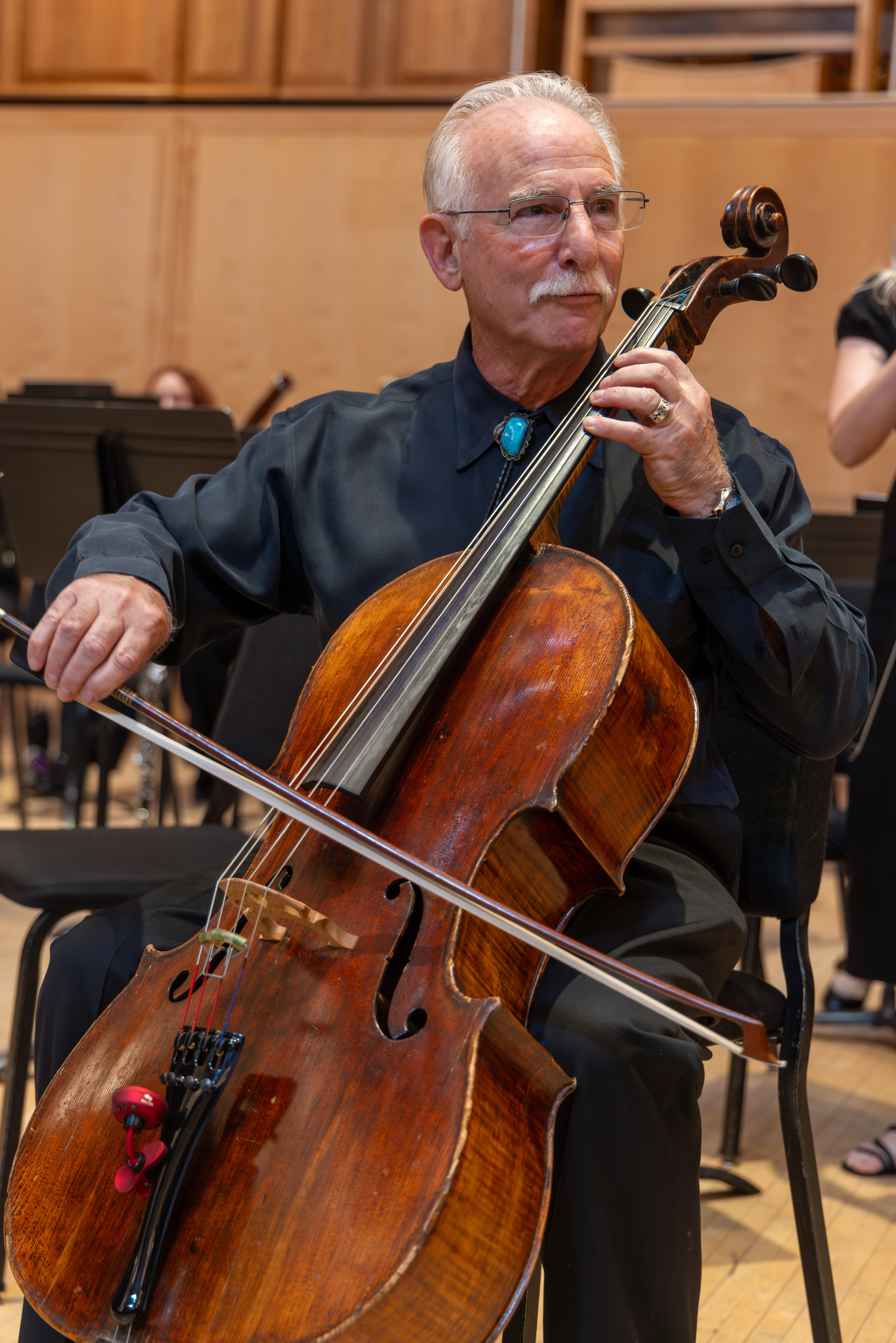 Perry G. Fine, M'81, plays the cello