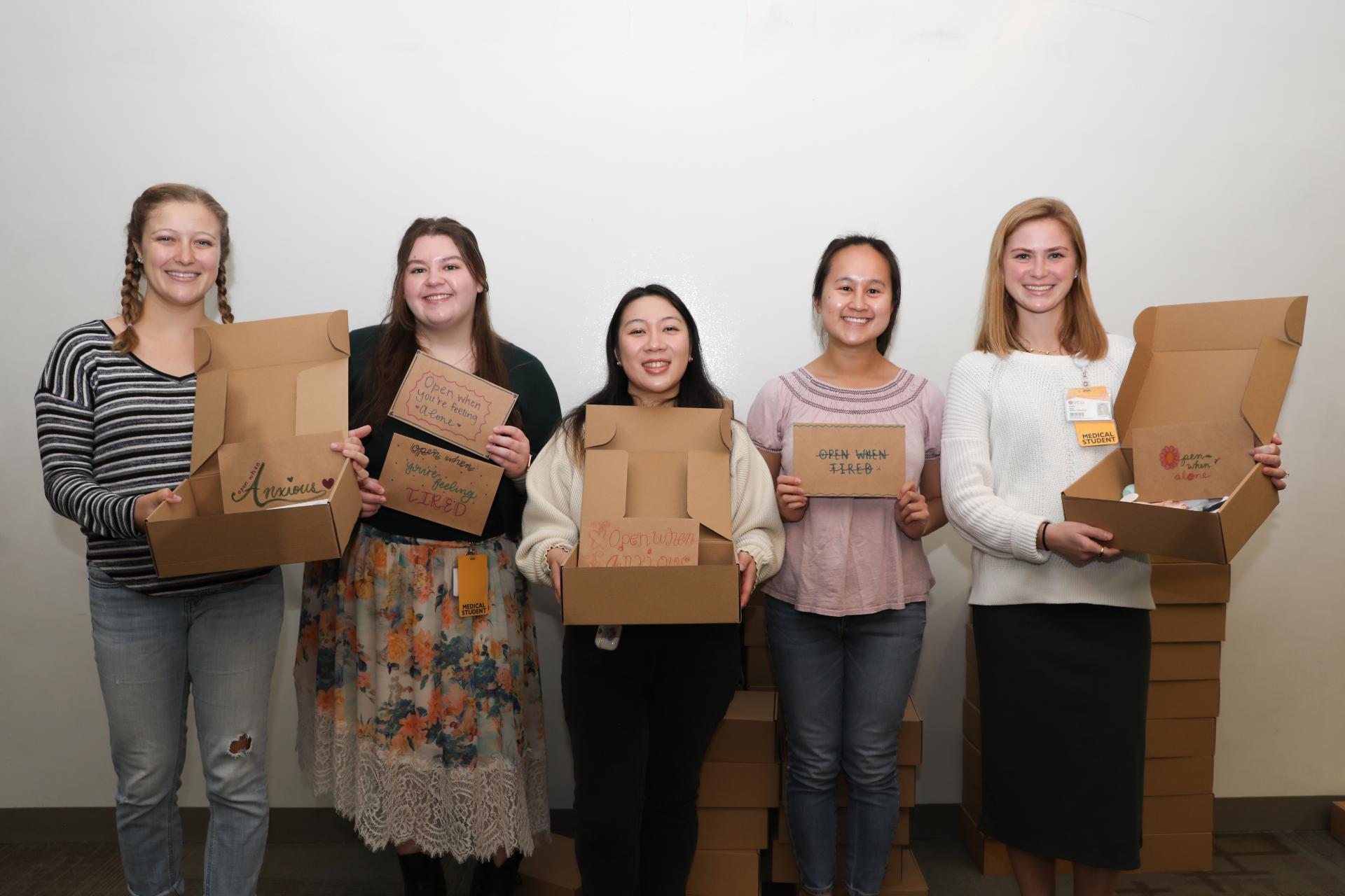 MSMHE leadership and volunteers with care packages for postpartum mothers. (Left to right) M2 Allison Tegner, M1 Sofiya Blat, M2 Pamela Dang, M2 Catherine Pham and M2 Noelle Maison (photo by Arda Athman, School of Medicine)