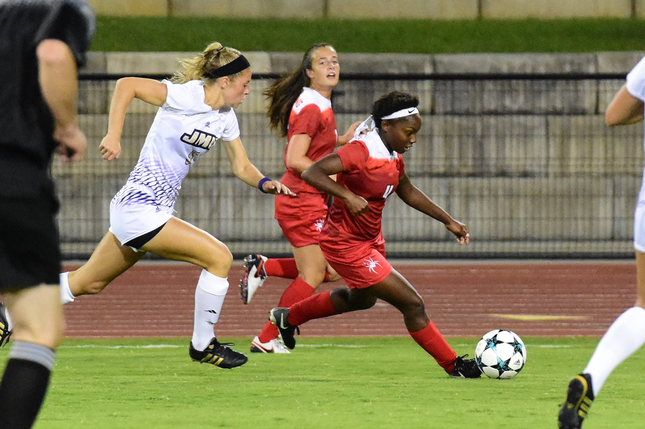  Keaira Clark (right, with the ball) played soccer at the University of Richmond. 