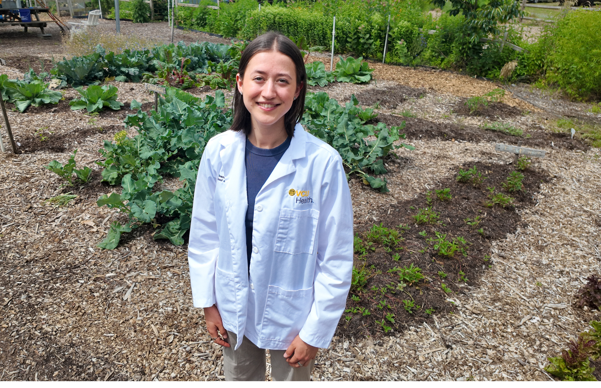 M3 Eleanor Dalsass in one of gardens at Bellemeade Park, where she frequently volunteers (Photo by Arda Athman, School of Medicine)