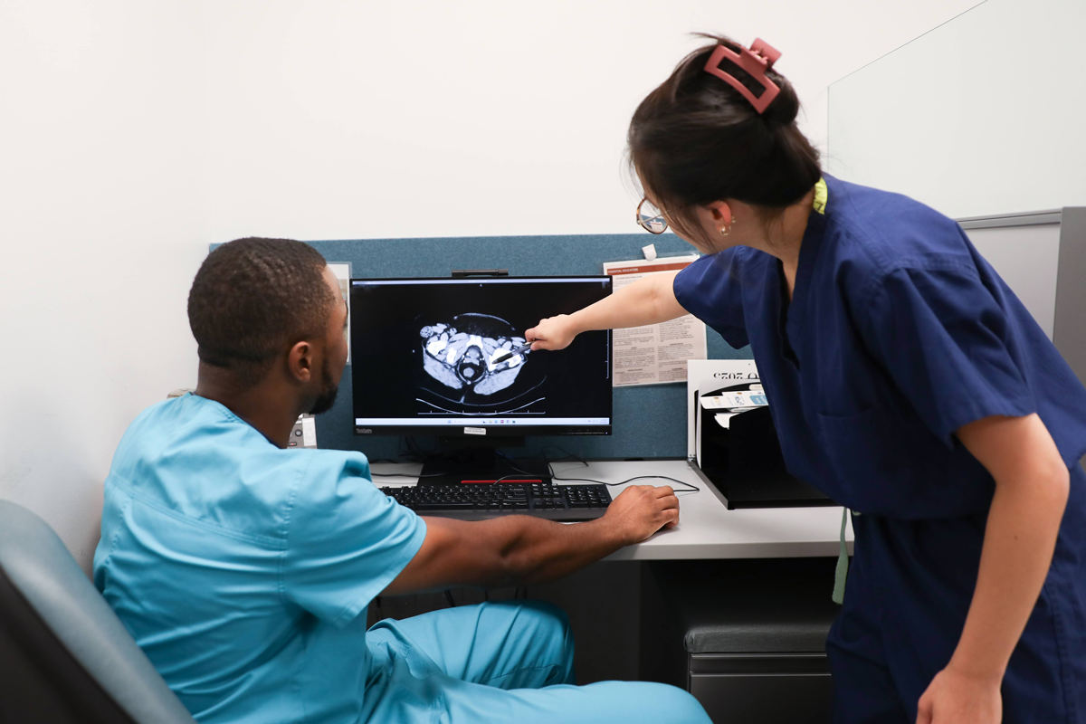 Resident works with a patient