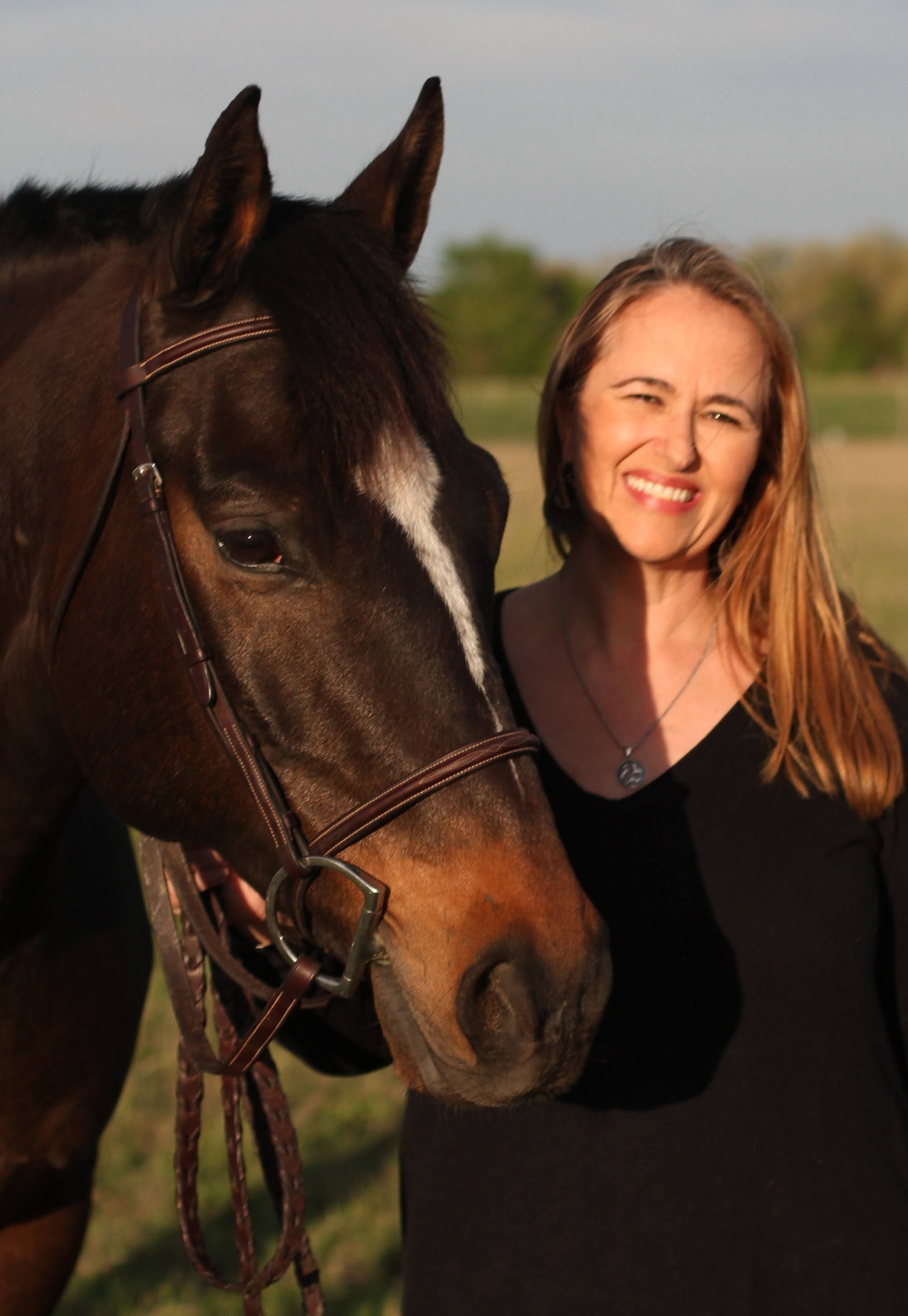  Theresa Jones Pugh, M'01, and her favorite horse, Teddy 