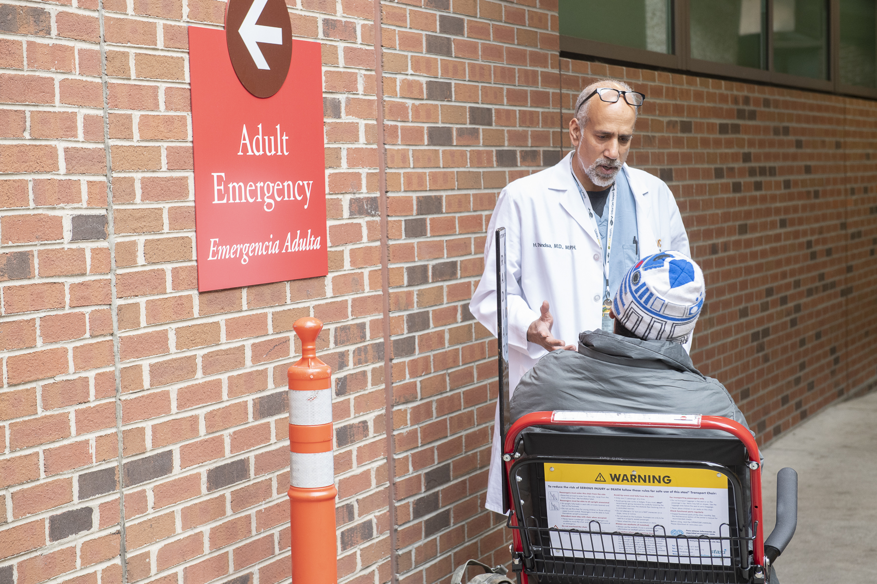 Harinder Dhindsa, M.D., talks with patient