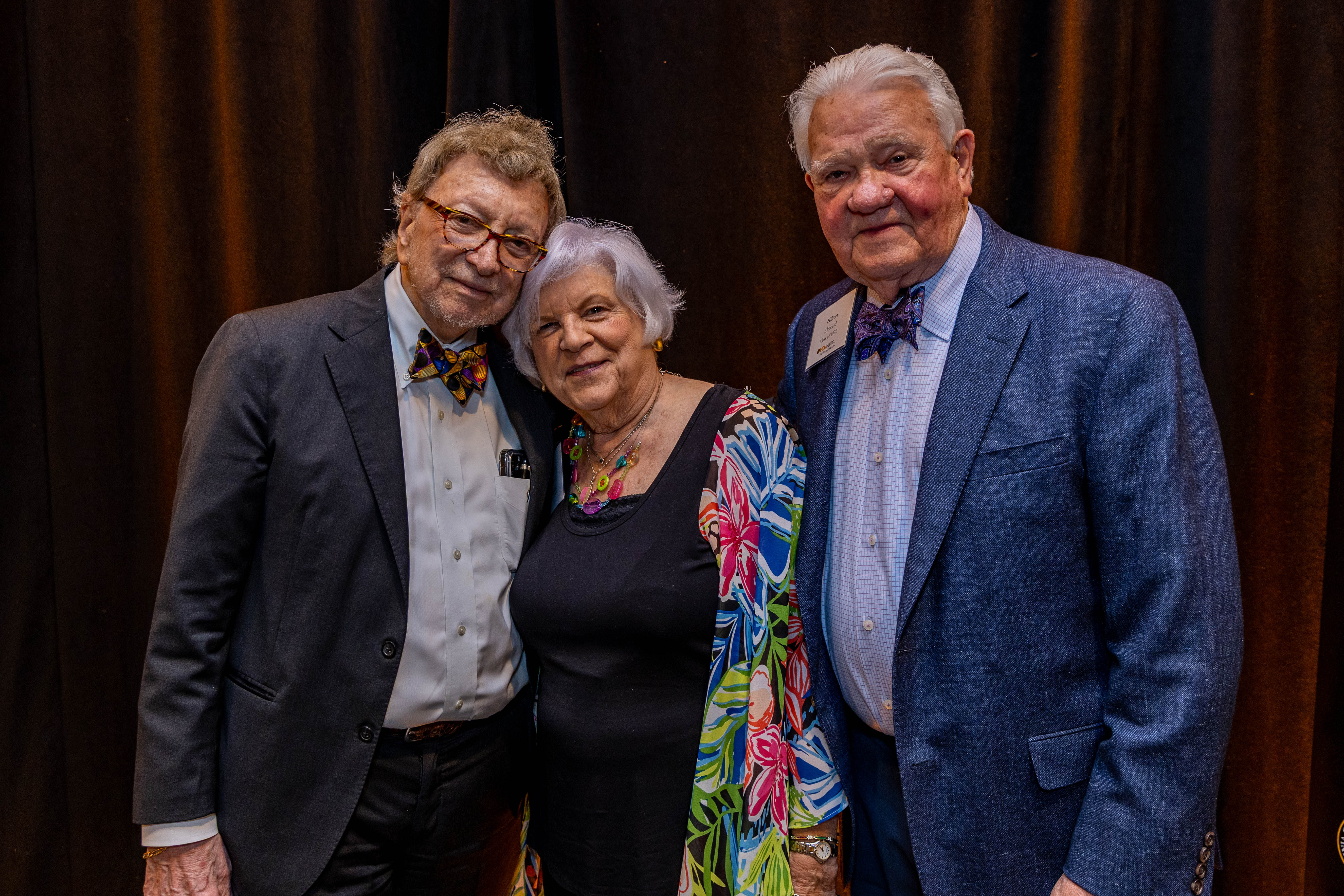 Three people smiling for a photo