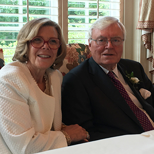 Adrienne and Bob Burrus sitting at table