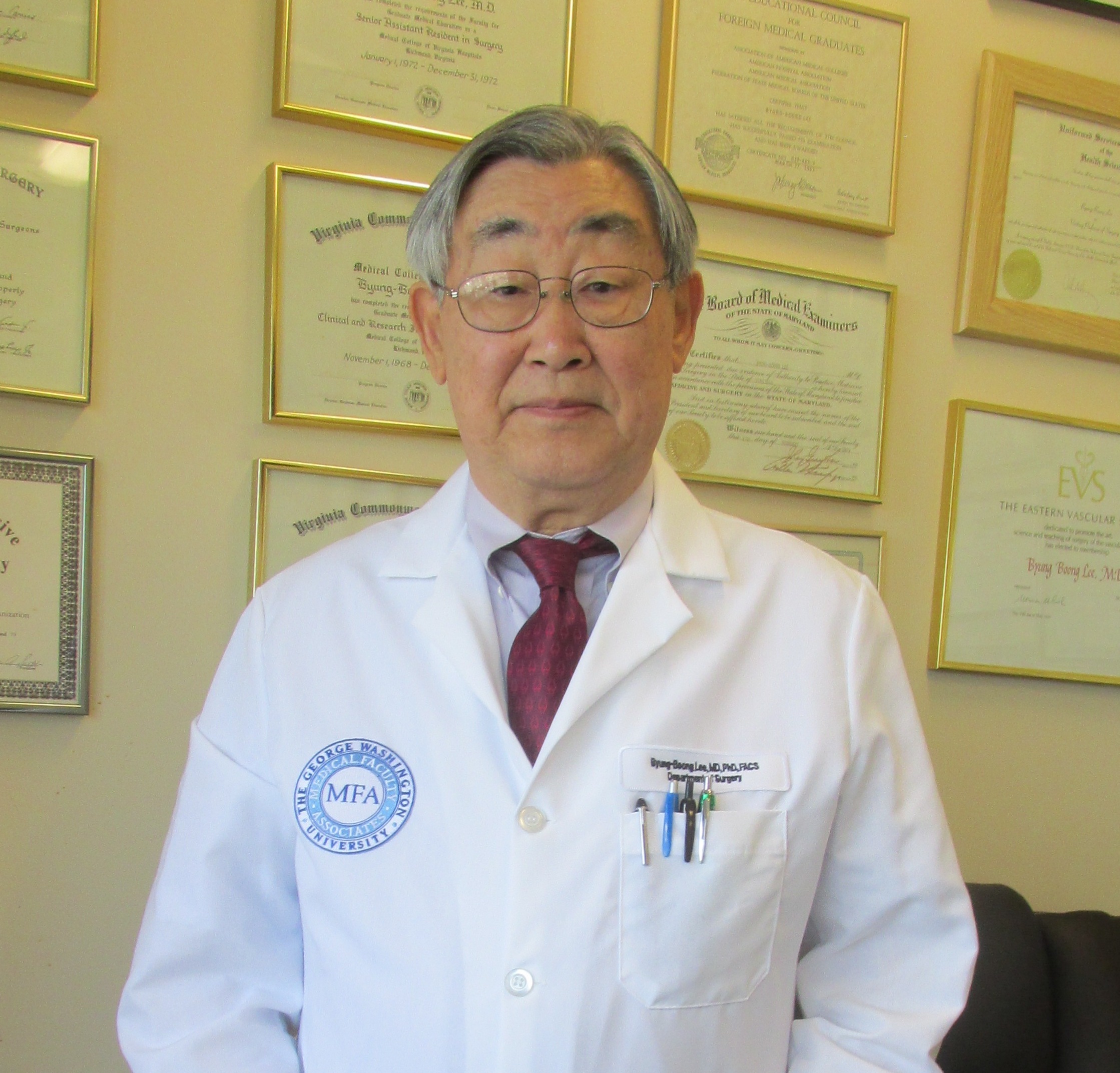 H73 Byung-Boong Lee stands smiling in his white coat