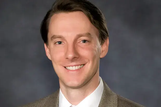 A headshot of Dr. Jason Carlyon from 2014