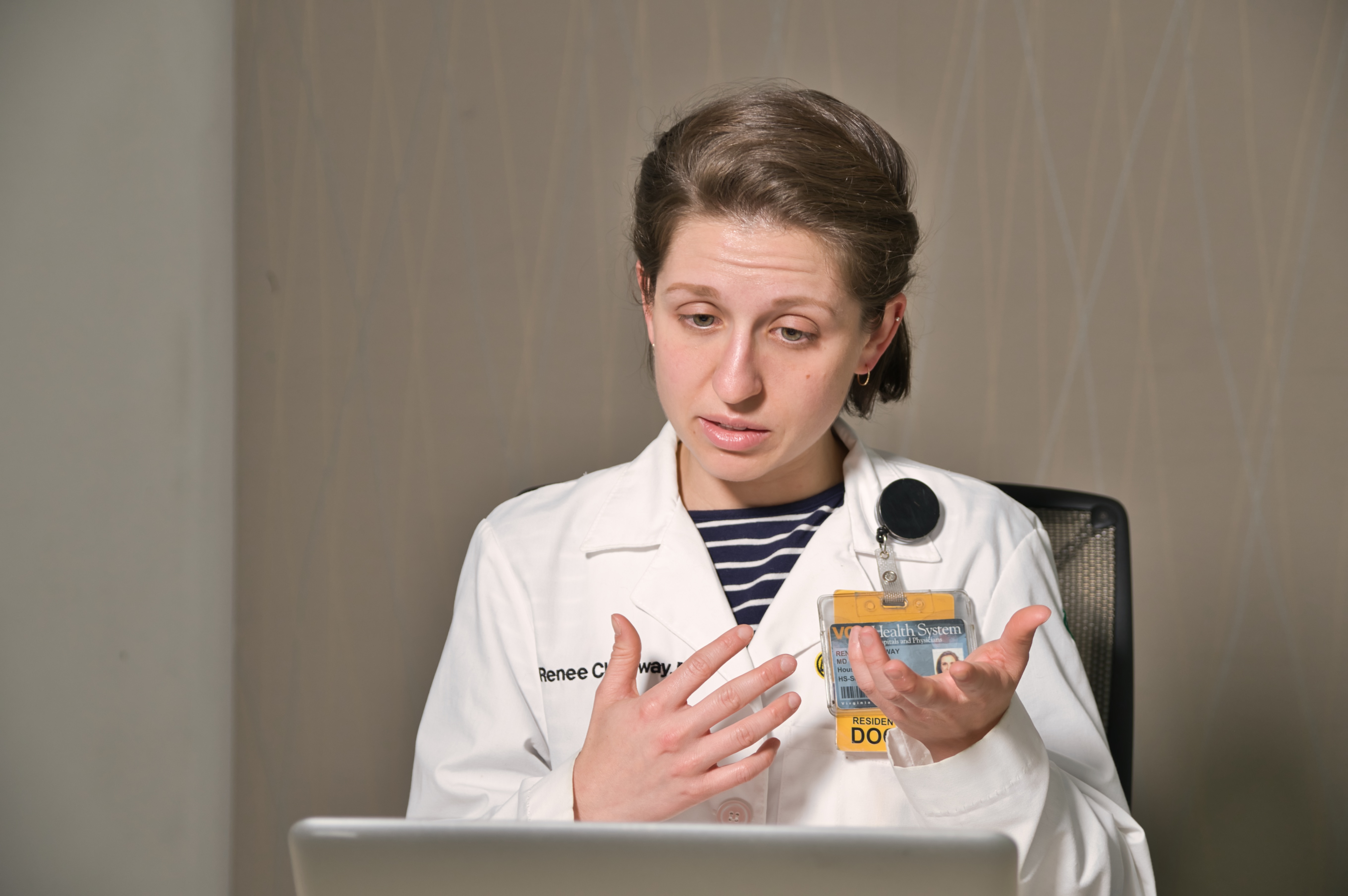 Renee Cholyway, M.D., in front of a laptop leading a virtual course.