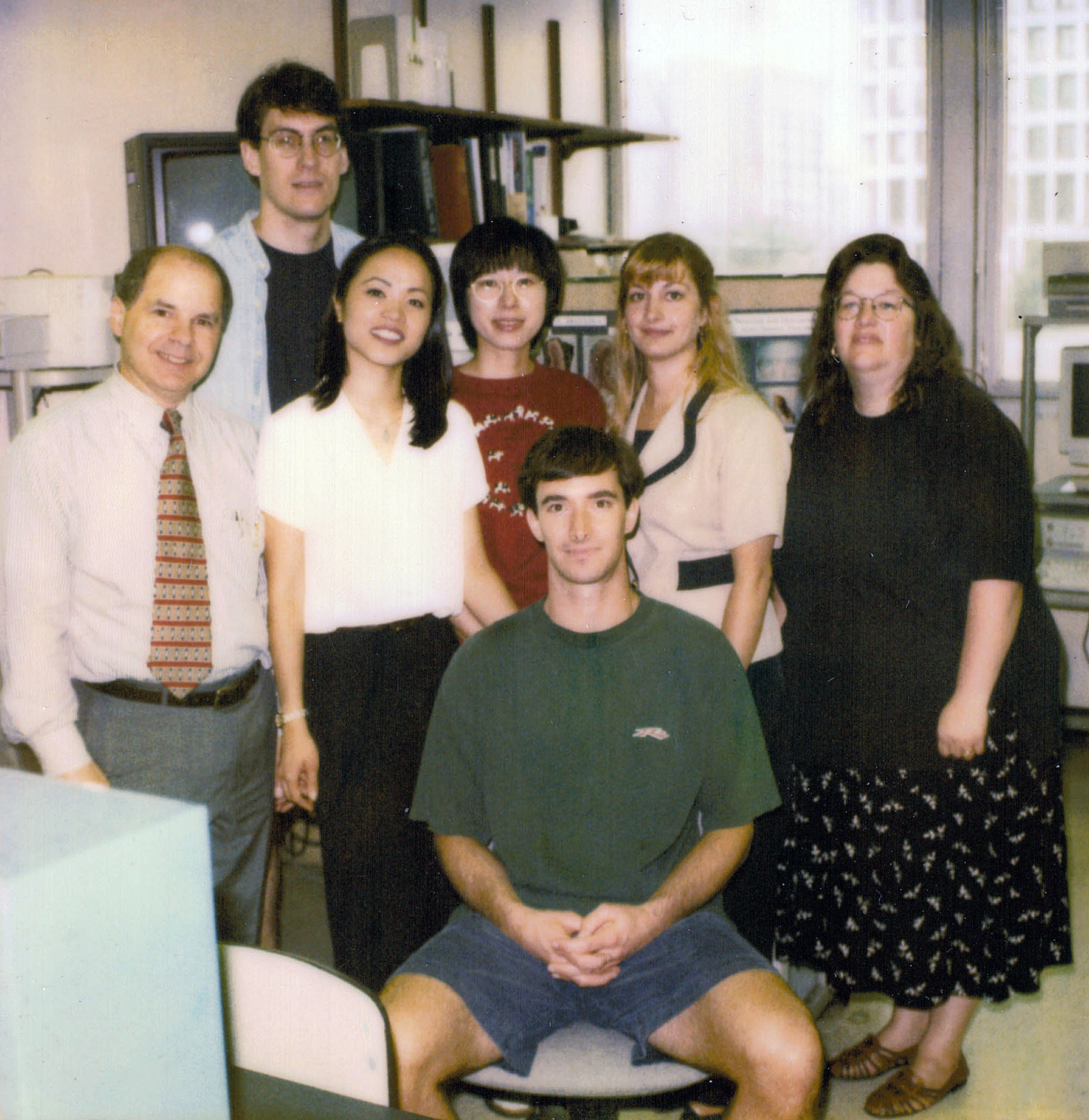 In this 1998 photo from the lab of Richard Costanzo, Ph.D., Mark Richardson, MS’99 (PHIS), MD-PhD’05, is seated in the front row with Eric Holbrook, M.D., H’00, standing in the back. The two reunited at Harvard Medical School.