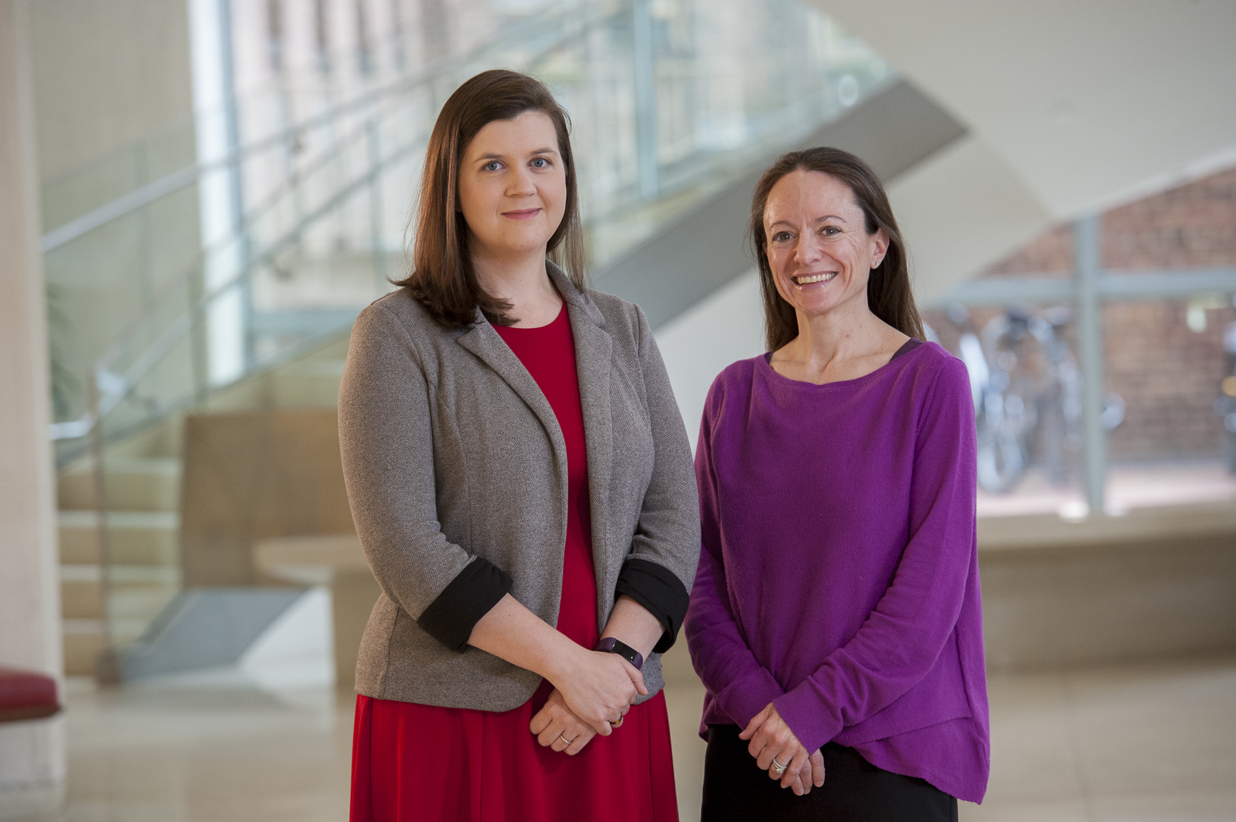 Jennifer Jordan PHD and Jordana Kron MD stand in the McGlothlin Medical Education Center lobby