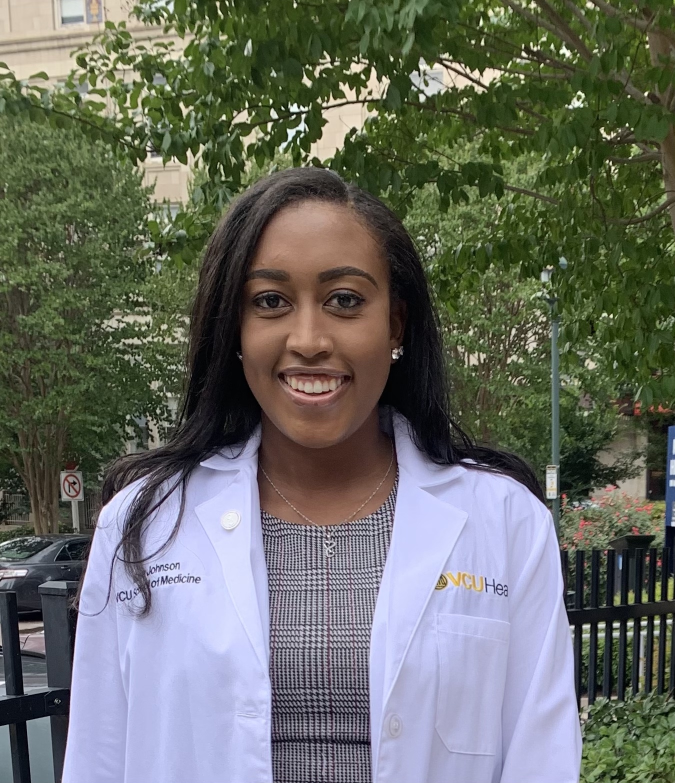 M23 of Maya Johnson wearing white coat