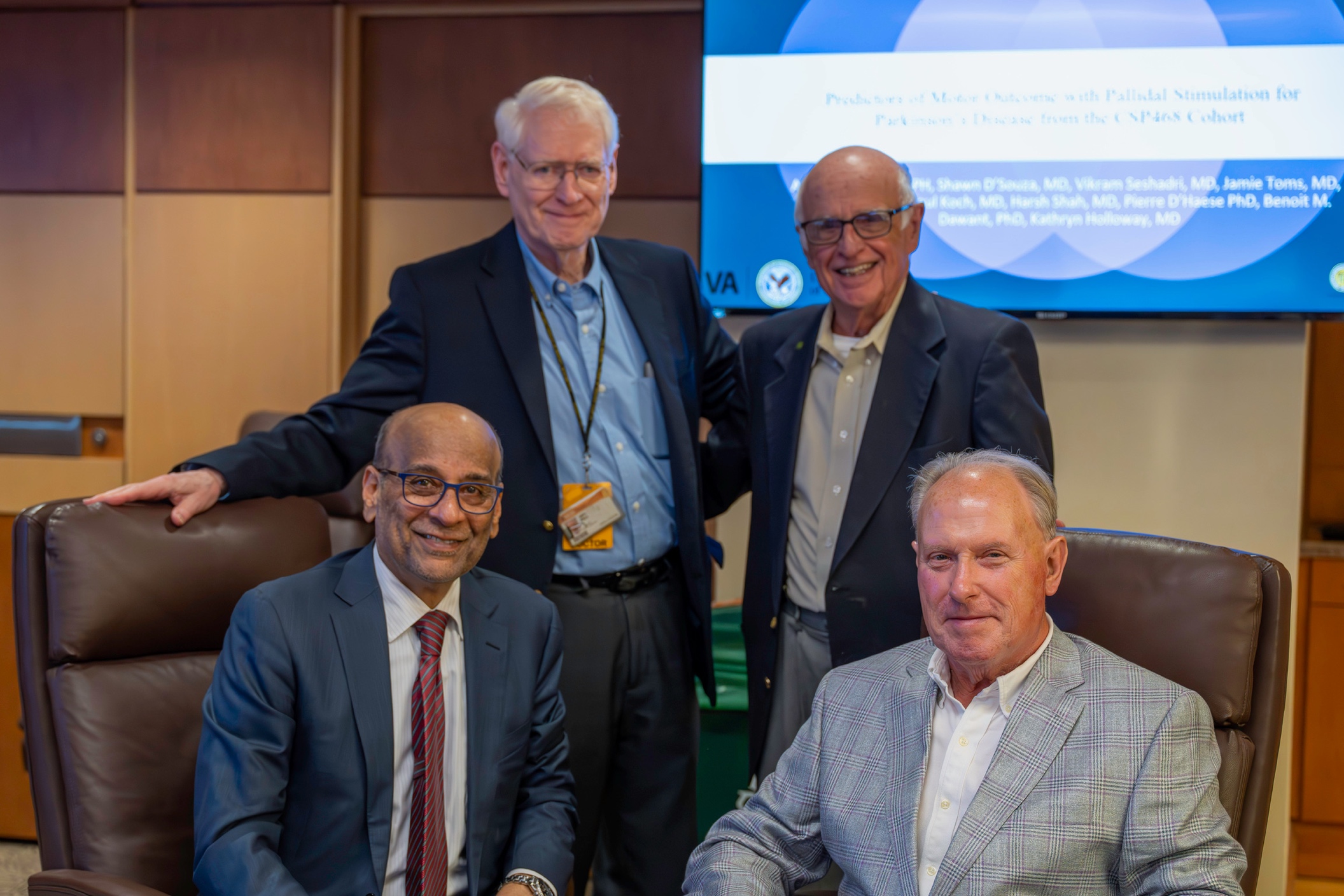 Raj Narayan, M.D., John D. Ward, M.D., Harold Young, M.D., and John Povlishock, Ph.D., reunite during the Department of Neurosurgery Resident Research Day.