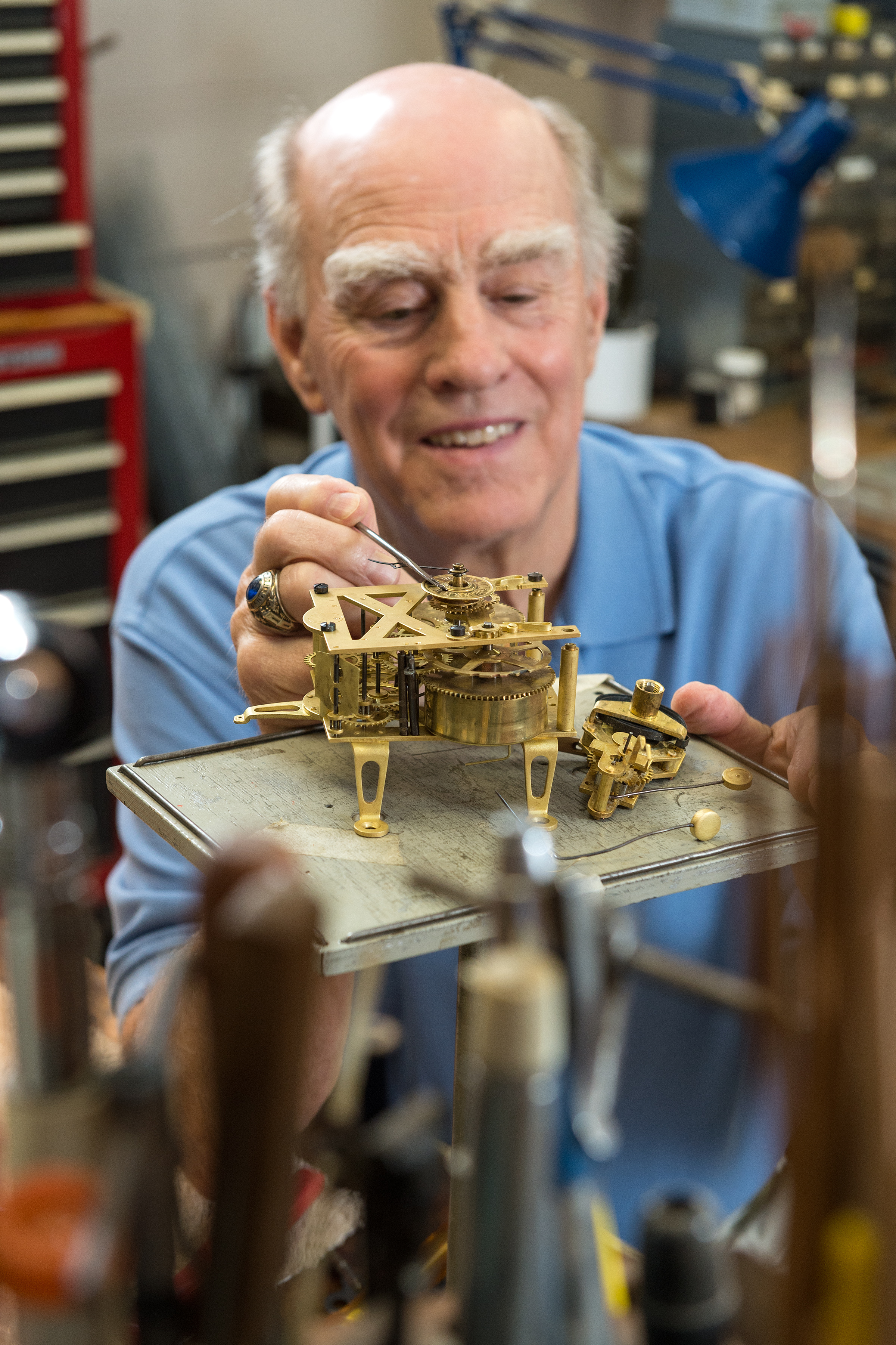 Andrew DelSordo, M’69, restores an antique clock.