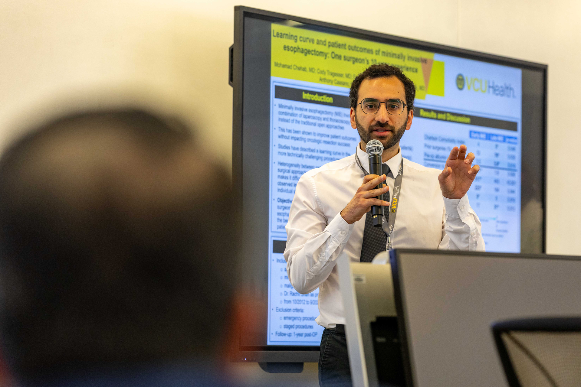 Mohamad Chehab, M.D., was one of the many members of the Department of Surgery to make a formal poster presentation during Research Day. Now in his third year of residency, Chehab’s study of a surgeon’s learning curve for a minimally invasive esophagectomy aims to increase surgical effectiveness and decrease postoperative complications. (Photo by Skip Rowland) 