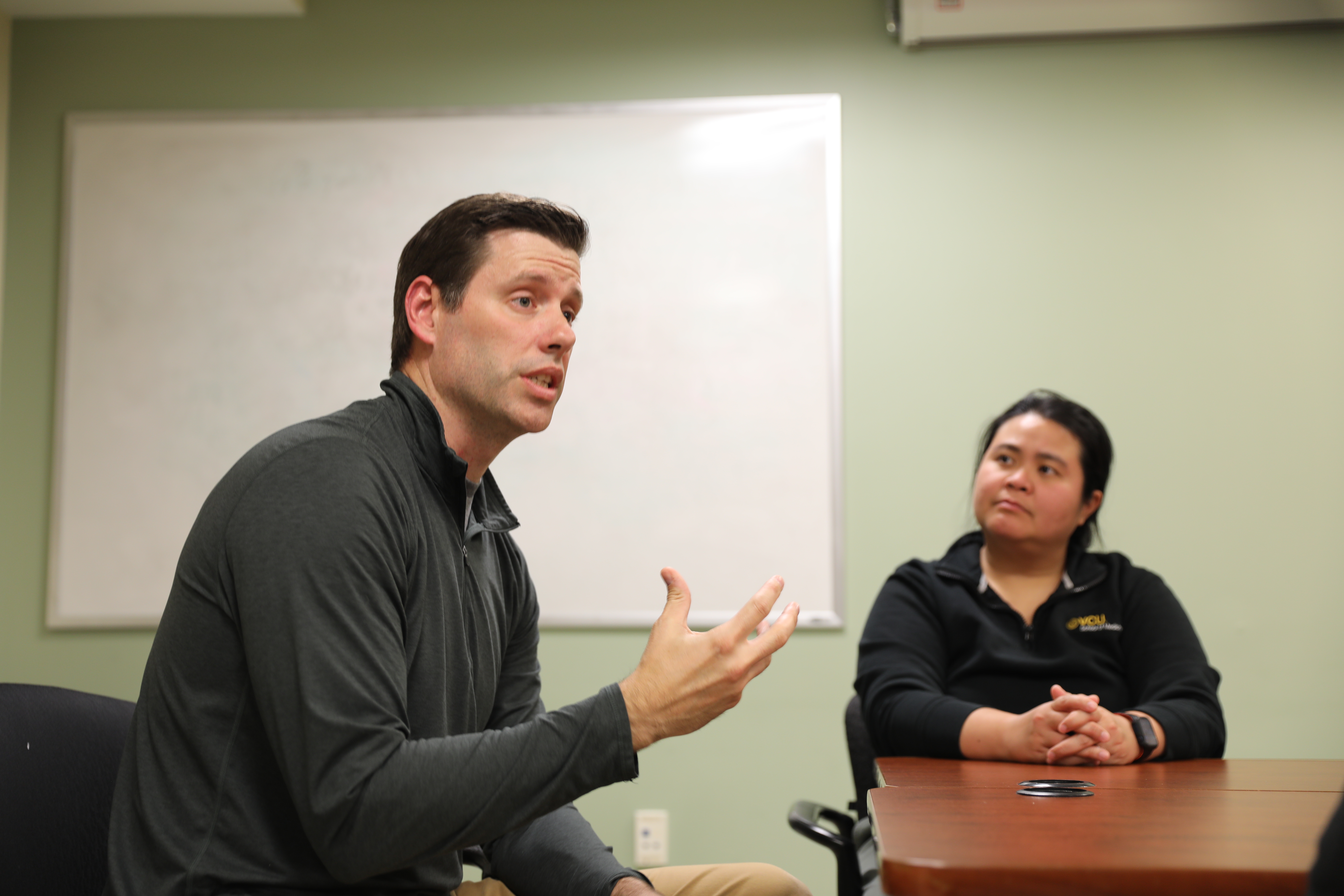 Stephen Miller, D.O., (left), the inaugural director of medical student research, speaks with student leaders about finding research opportunities. (Photo by Arda Athman, VCU School of Medicine)