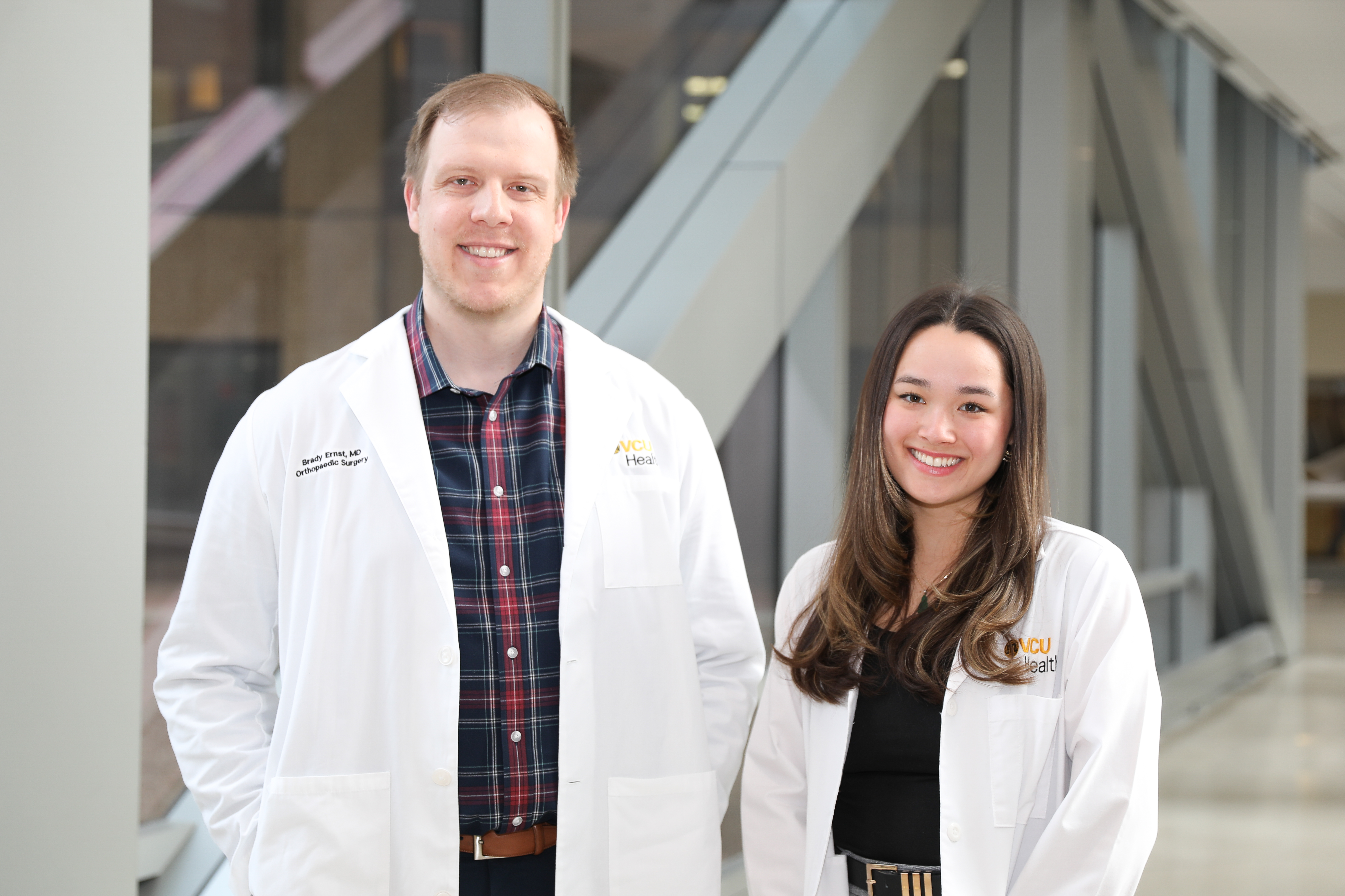 Brady Ernst, M.D. (left), an orthopaedics resident and Brigitte Lieu, an M3, both participate in the Department of Orthopaedic Surgery