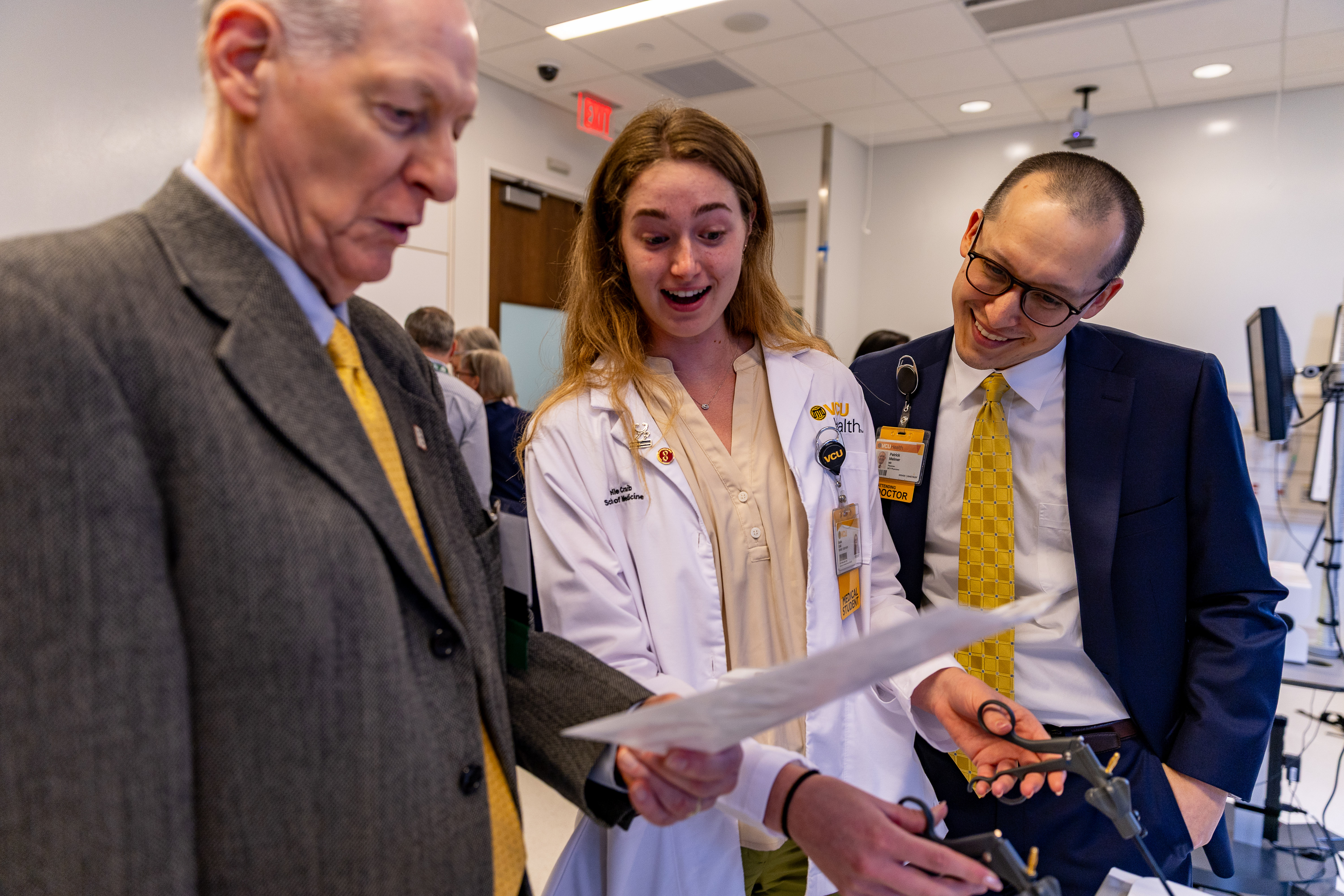  Alumnus and student participate in a laparoscopic teamwork activity. 
