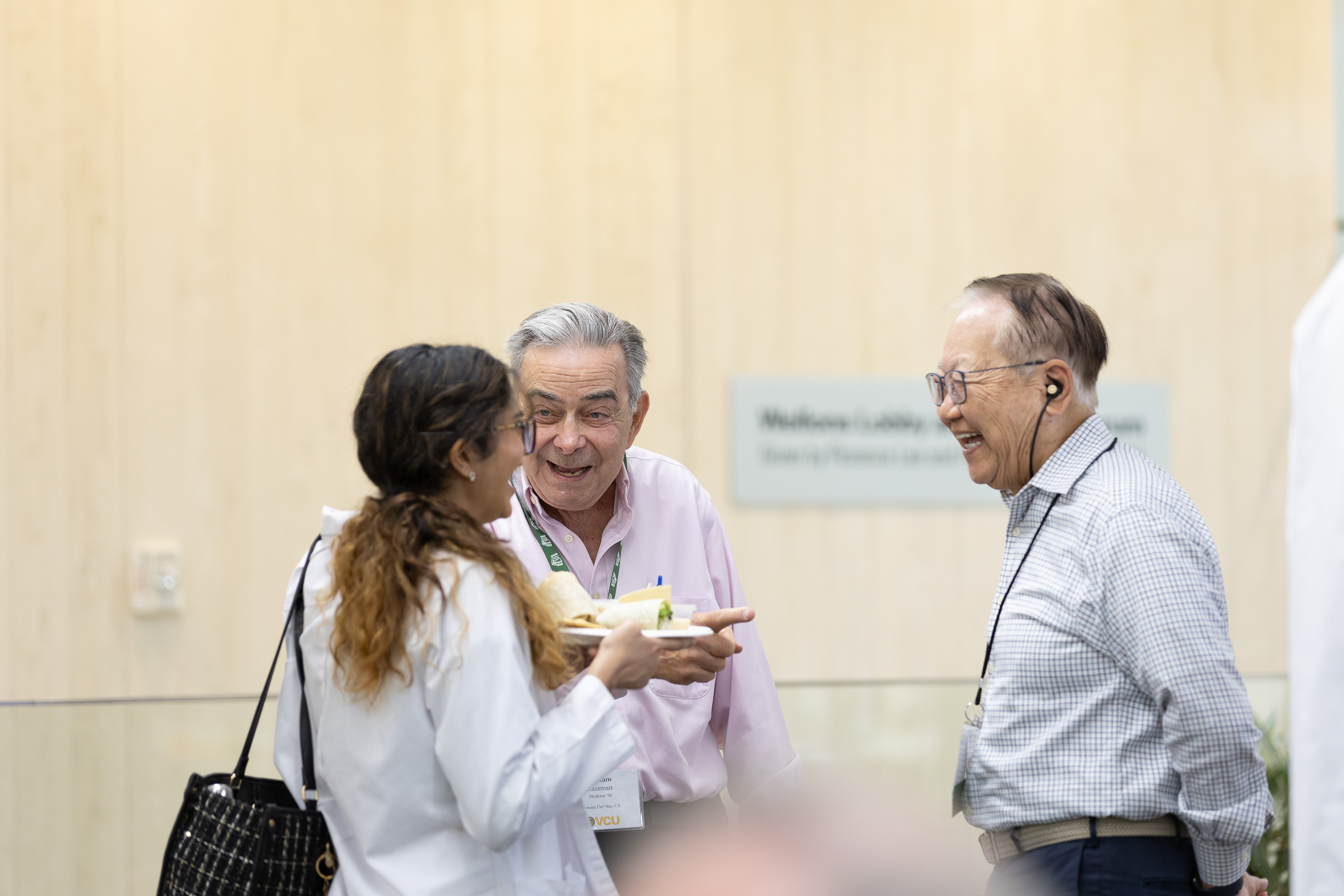  Alumni talk with a current student in the McGlothlin Medical Education Center. 