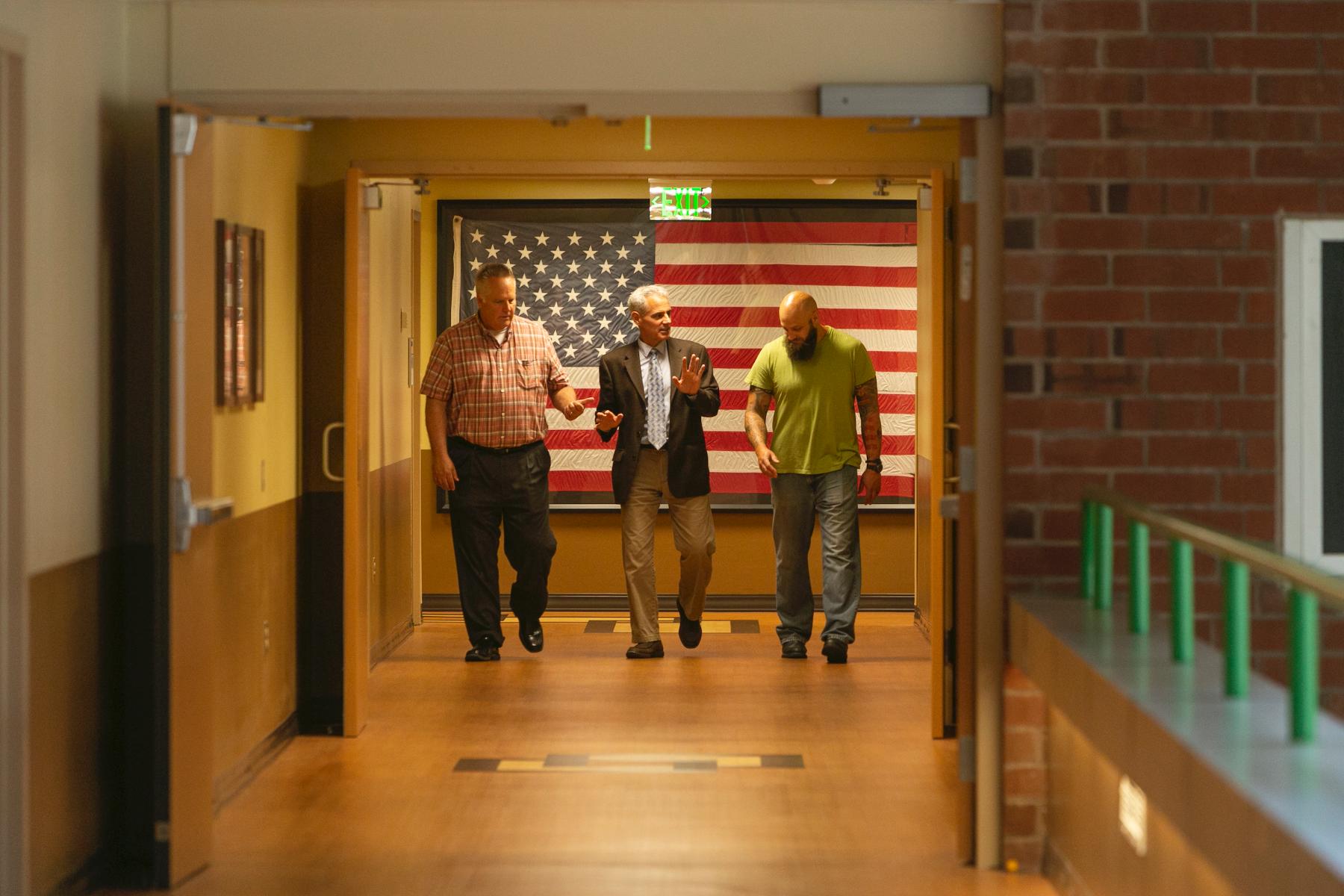 David Cifu, M.D., chair of the Department of Physical Medicine and Rehabilitation, walking alongside two veterans.