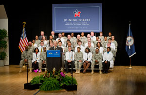 Dean Jerry Strauss shared the stage with First Lady Michelle Obama. He represented the 101 medical colleges that signed a pledge to support the Joining Forces initiative. Photo courtesy of VCU Creative Services