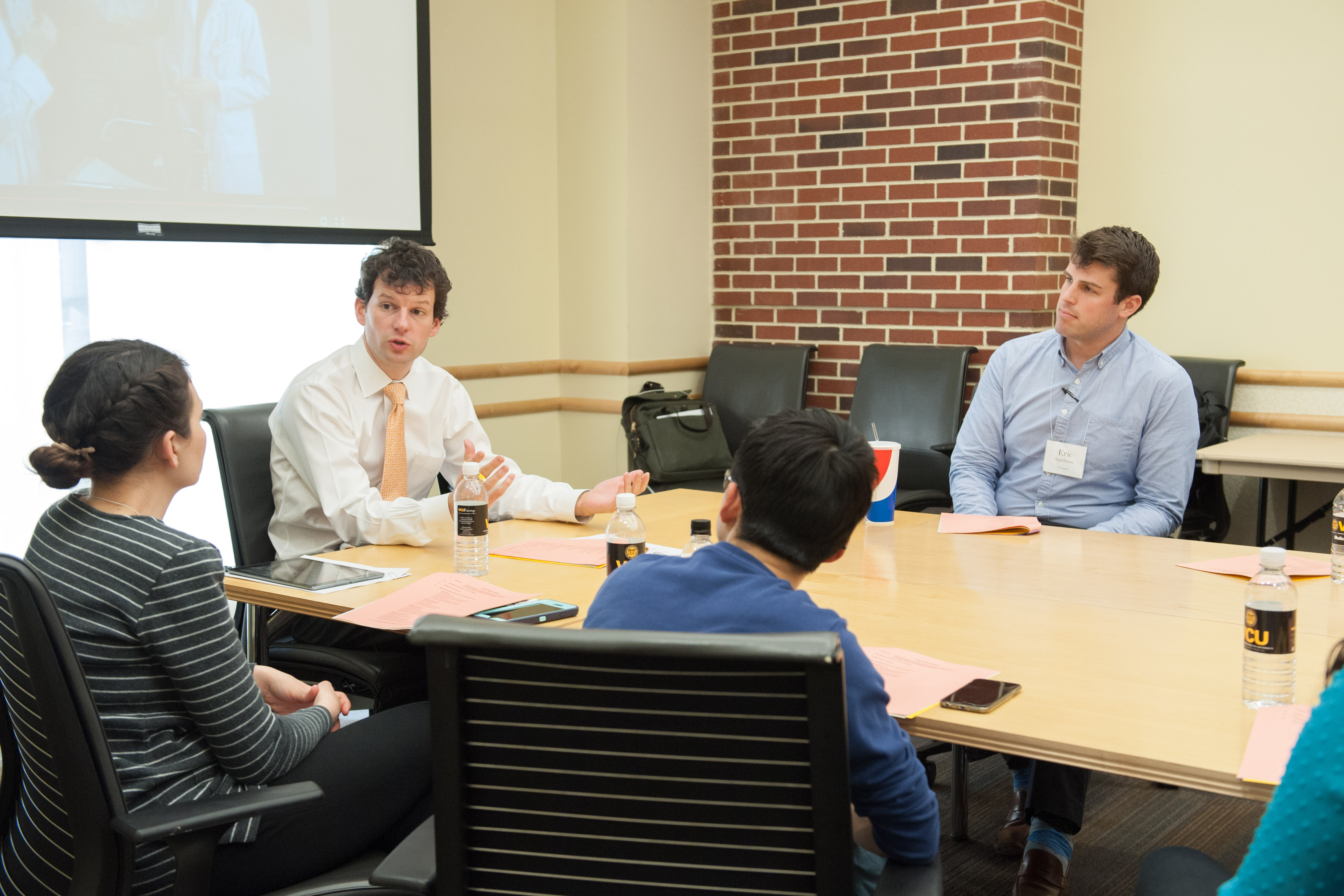 Gregory Trimble, M’03 (center), is assistant dean for faculty at the VCU School of Medicine’s Inova Campus in Fairfax. 