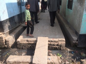 A Bangladeshi child reminds Donowitz not to step in the open sewer. Environmental enteropathy is a low-level chronic inflammation in the GI tract that’s found in a large number of children living in unsanitary conditions.