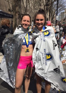 Classmates and training partners Suzanne Giunta (left) and Amanda Filiberto at the finish line of the 2016 Boston Marathon in April.