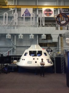 Fourth-year medical student Brent Monseur in front of NASA’s Orion spacecraft, the first vehicle designed for deep space exploration.