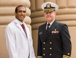 Third- year student Braveen Ragunanthan with award presenter Cmdr. Ray Ford.