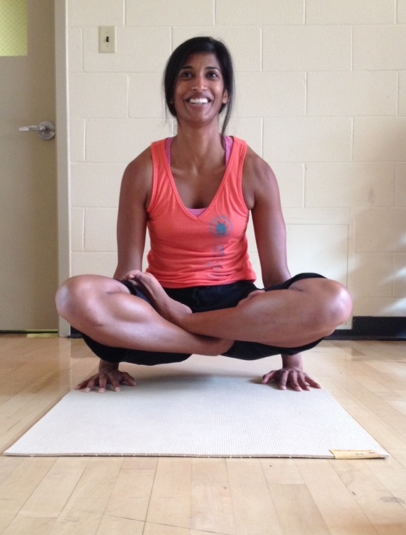 Trina Chakrabortty demonstrates the “Tolasana” or scale pose.