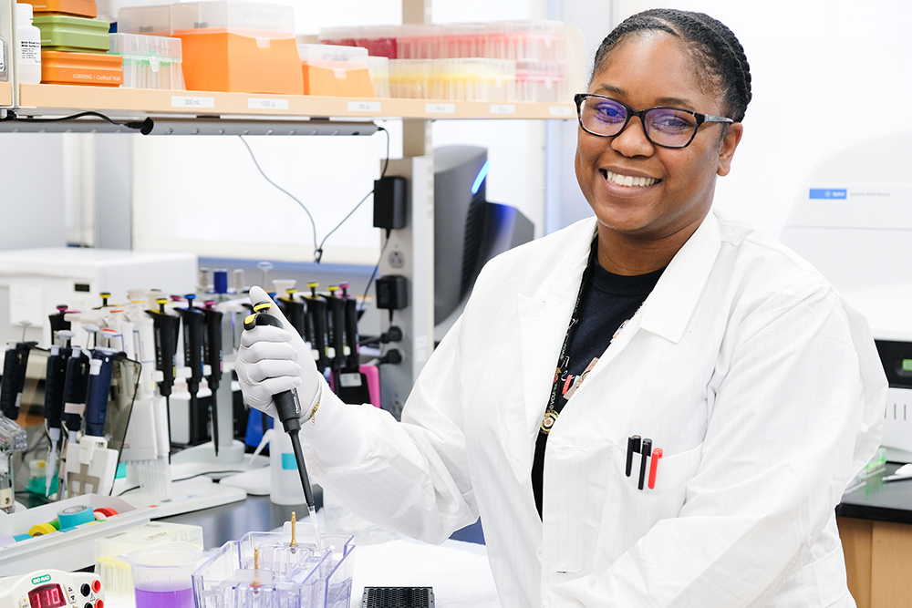 Research student with a pipette