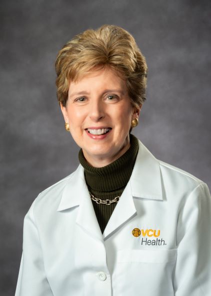 Portrait of Ann Fulcher MD FACR in white coat
