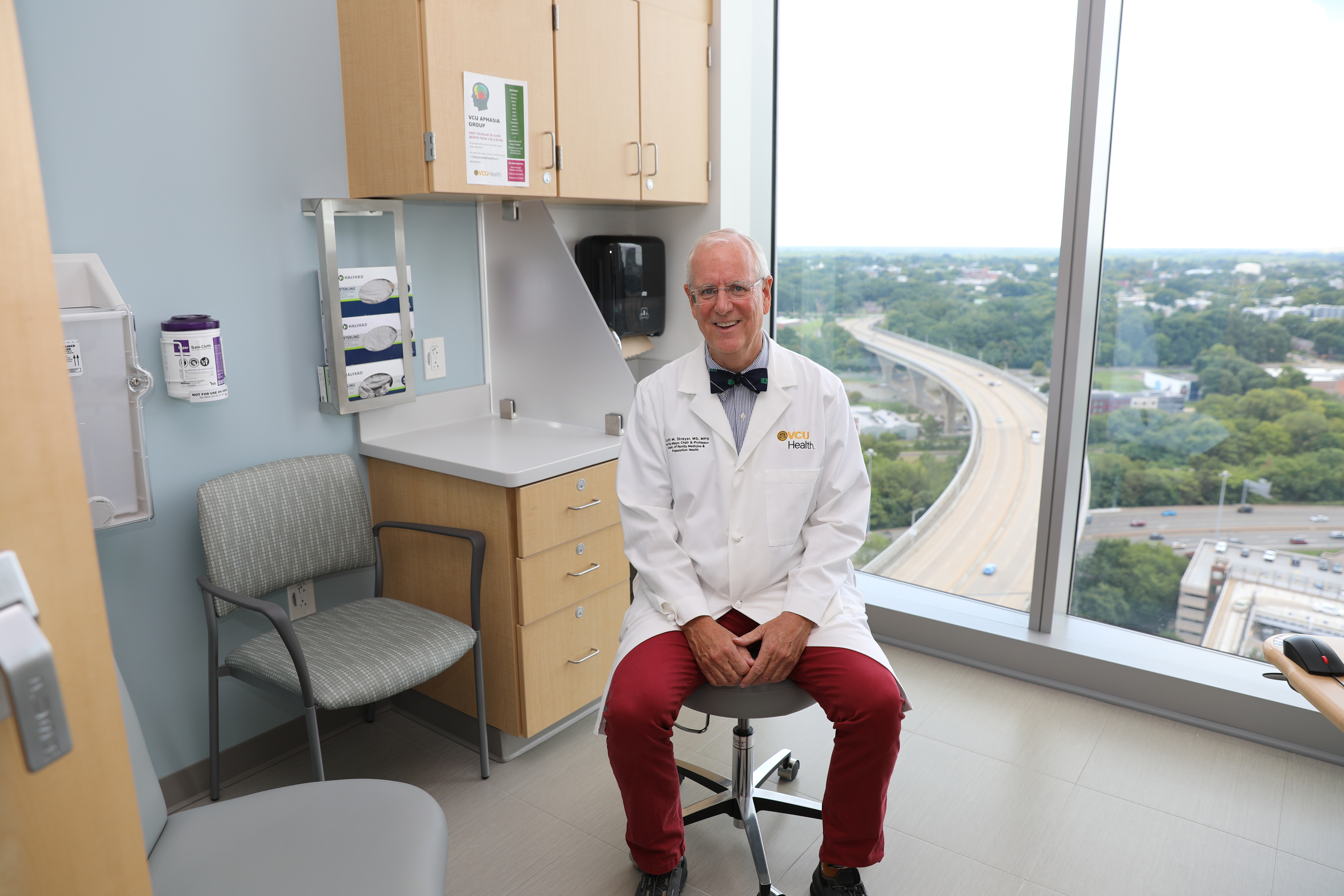 VCU Department of Family Medicine and Population Health Chair Scott M. Strayer, M’94, H’97, sits in the VCU Health Adult Outpatient Pavilion, where larger clinical spaces allowed for the department’s expansion after a move from Nelson Family Medicine in 2023. (Photo by Arda Athman)   