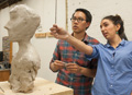 Two sculpture students talking about a scupture